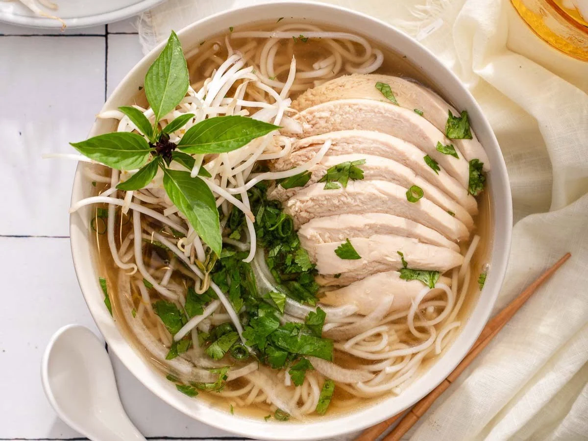 Authentic Vietnamese chicken pho noodle soup at Pho Ngon - rich broth with fresh herbs, bean sprouts, chilies and tender chicken